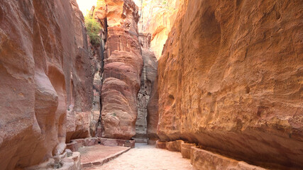 Tourist route through the gorge to Petra - Nabataean rock temple. Jordan
