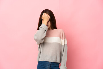 Little girl isolated on pink background with headache