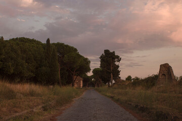 Naklejka premium sunset on ancient roman road of appian way