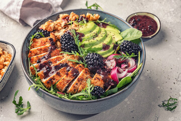 Grilled chicken breast, fillet and fresh vegetable salad of lettuce, arugula, spinach, avocado,...