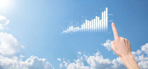 Business man holding tablet and showing holographic graphs and stock market statistics gain profits. Concept of growth planning and business strategy. Display of good economy form digital screen.