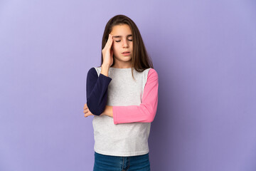 Little girl isolated on purple background with headache