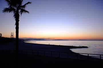 Fototapeta na wymiar 夕陽と海岸風景