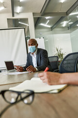 Leader telling to employees in coworking office