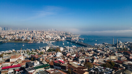Fototapeta na wymiar Aerial view of the Bosphorus Strait from the side of Suleymaniye Mosque. Top view of the beautiful cityscape of Istanbul, parts of Asian Turkey (Anatolia) from European Turkey on sunny day.