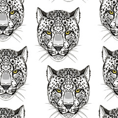 Seamless pattern with the image of the head of a snow leopard in the form of a hand drawing. 