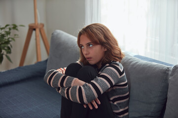 Teenage girl being bored and difficult at home.