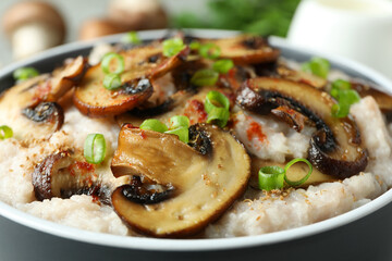 Concept of tasty food with risotto with mushrooms, close up
