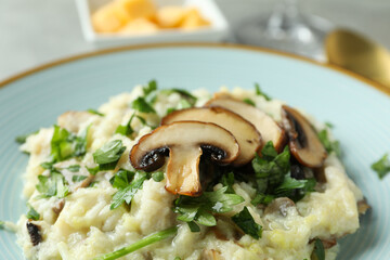 Concept of tasty food with risotto with mushrooms, close up