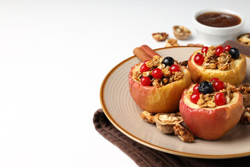 Concept of tasty food with baked apples on white background