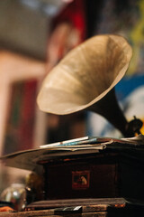 An old musical gramophone is in the room
