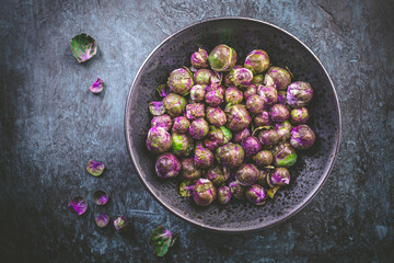 Organic Fresh Purple Brussels sprouts in bowl