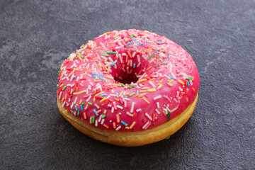 Sweet glazed struwberry donut with icing