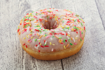 Sweet glazed vanilla donut with icing