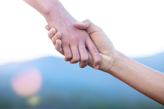 helping hand with mountain background
