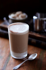 Coffee with milk on wooden  background. Close up.	