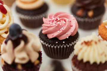 Chocolate cupcake with raspberry cream and sugar pearls