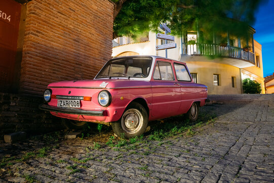 Parked Rarity Tuning Pink Minicar Zaporozhets On Paved Street In Old District Of Tbilisi, Georgia