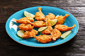Crispy Fried Butterfly Shrimp on a blue plate