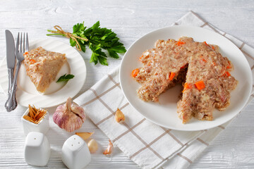 meat aspic, jellied slow cooked meat on a plate