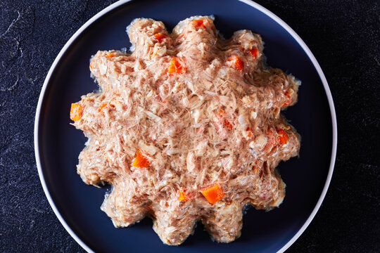 meat aspic, jellied slow cooked meat on a plate