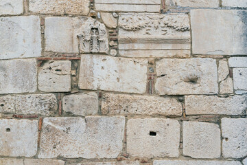 old wall of old Romanesque blocks as a background, Benevento, Campania, Italy