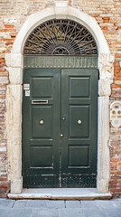 Old front door. Venice in Italy.