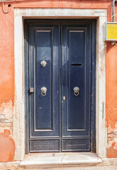 Old front door. Venice in Italy.