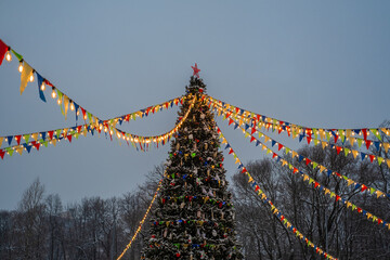 Christmas tree, colored flags and lights