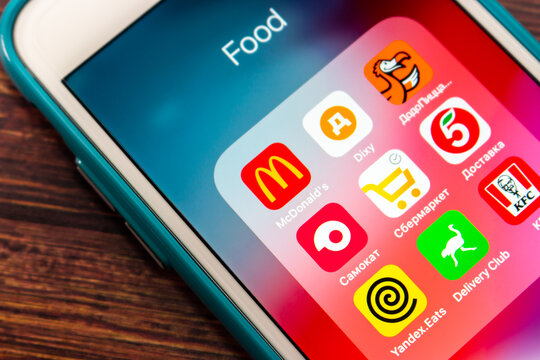 Kumamoto, JAPAN - Jun 8 2021: Mcdonald&rsquo;s and other popular food, grocery and delivery brands in Russia (DIXY, Dodo Pizza, Samokat, Pyaterochka, SberMarket, Yandex.Eats, Delivery Club and KFC).