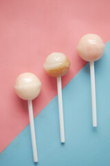 top view of lollipop candy on color background 