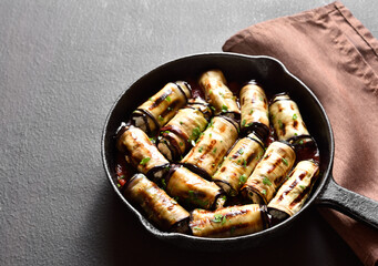 Eggplant (aubergine) rolls with cheese and greens