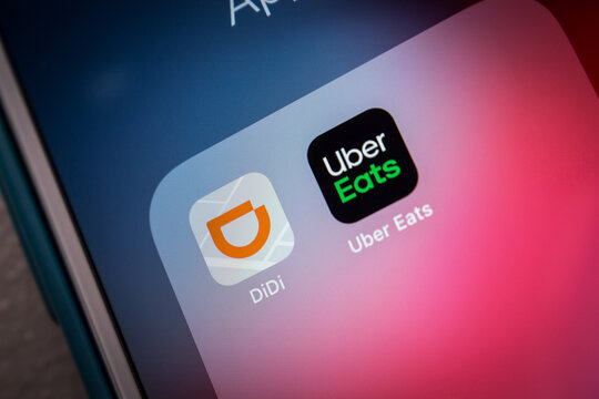 Kumamoto, JAPAN - Jul 7 2021 : Concept image of DiDi Rider and Uber Eats apps on iPhone screen. DiDi is a Chinese vehicle for hire company headquartered in Beijing.