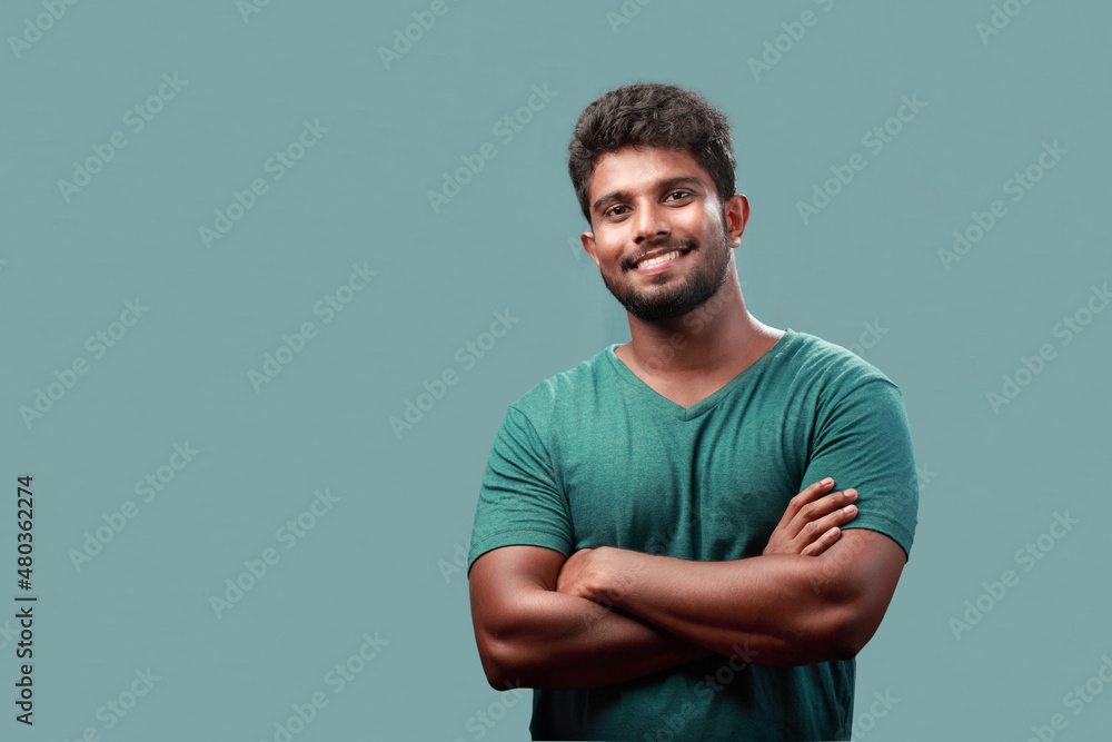 Wall mural Portrait of a smiling young man of Indian origin