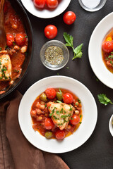 Cod stew with chickpeas, cherry tomatoes and olives