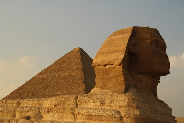 head of the sphinx and Cheops pyramid