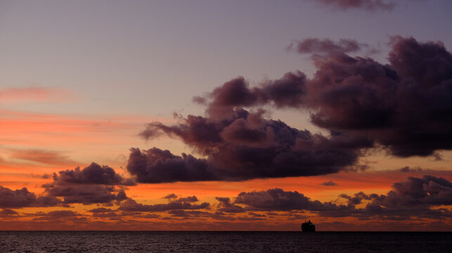 Cruise ship and sunrise clouds
