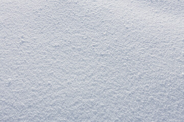 Texture of white loose snow in winter