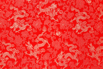 Red fabric with a dragon pattern. The concept of the Chinese New Year. copy space. Red background