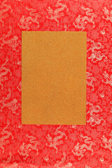 Red fabric with dragon pattern with gold copy space for text. The concept of the Chinese New Year. to copy space. Red background