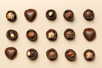 Different kinds of chocolates on colored table close-up. Top View and Flat Lay