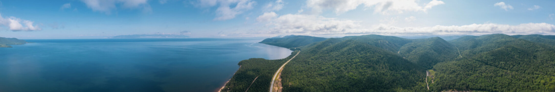 Summertime imagery of Lake Baikal in morning is a rift lake located in southern Siberia, Russia. Baikal lake summer landscape view. Drone's Eye View. Panoramic view.