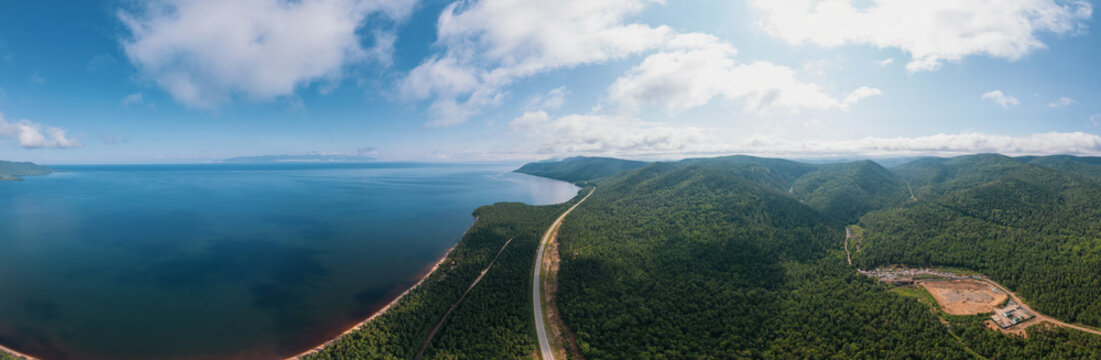 Summertime imagery of Lake Baikal in morning is a rift lake located in southern Siberia, Russia. Baikal lake summer landscape view. Drone's Eye View. Panoramic view.