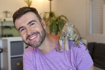 Man showing his spectacular Iguana