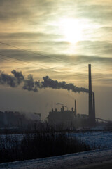 Industrial city at sunset on a winter day 