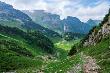 Path leading down into a valley in the Swiss mountains
