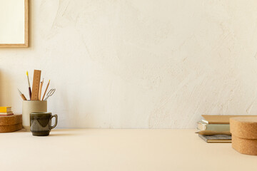 Home office, workspace with books, boxes and supplies.