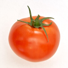 Ripe tomato on the white paper background. - 480367084