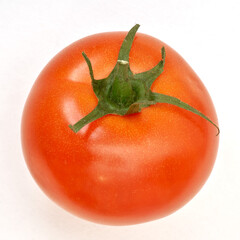 Ripe tomato on the white paper background. - 480367086