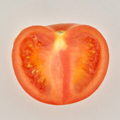 Cutted ripe tomato on the white paper background. - 480367087